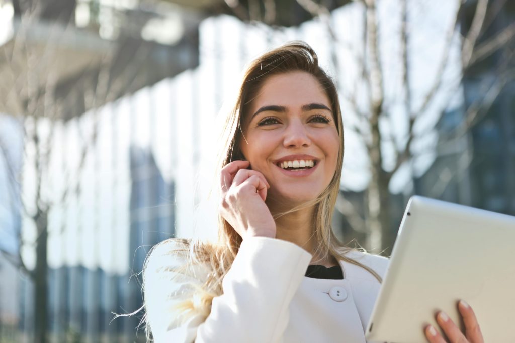 pexels-photo-789822-789822 Woman In White Blazer Holding Tablet Computer
